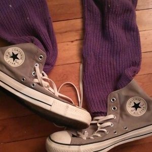 Converse High Tops with attached leg warmers.
